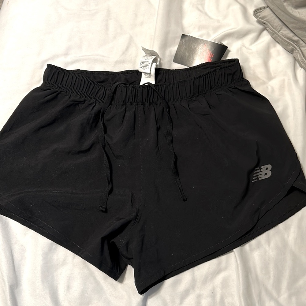double lined NB small black, tennis shorts. Seem to run a tad big to me.